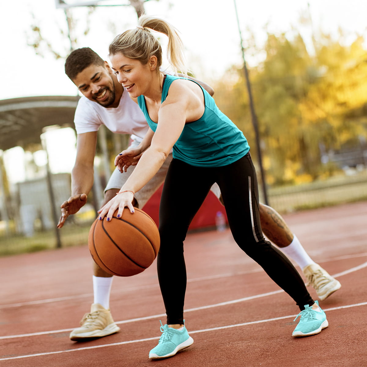image of a group people playing basketball. 